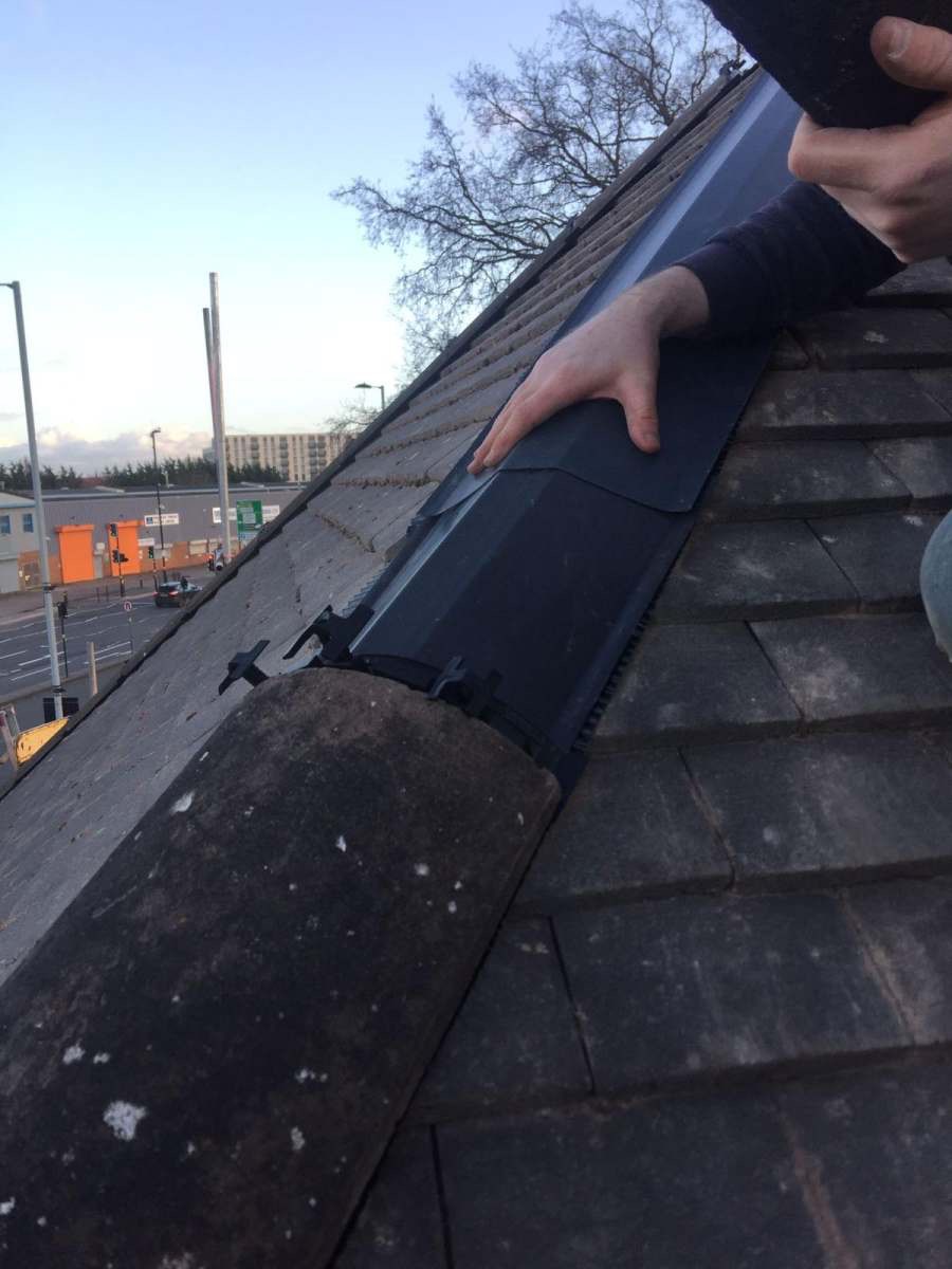 Fitting black dry-verge end caps to a tiled roof edge