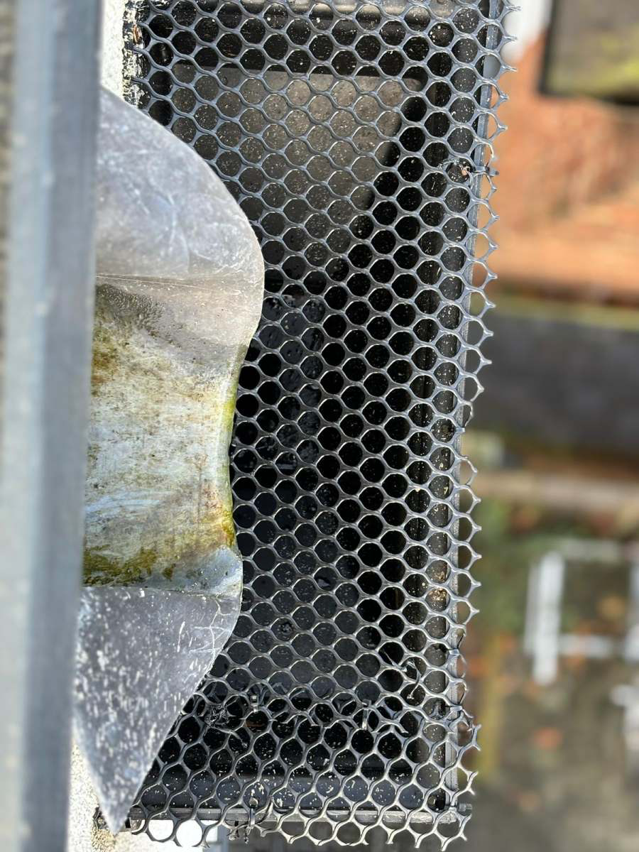 Black mesh gutter guard fitted to prevent leaf blockages
